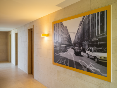 small changes that transform a hallway using lighting and wall art